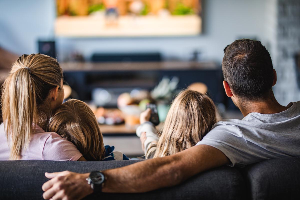 Family enjoying television